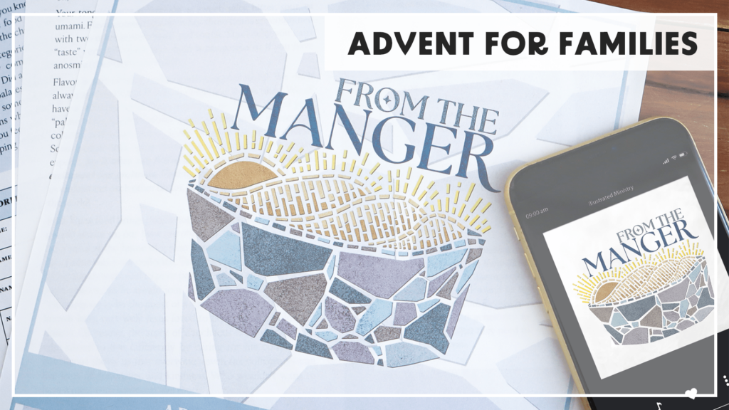 Image showing an Illustrated Ministry booklet titled "From the Manger" with a stylized mosaic illustration of a manger. A smartphone next to the booklet displays the same cover art in a music streaming app. The background includes various papers, creating a cozy, family-oriented feel. A banner at the top reads "ADVENT FOR FAMILIES."